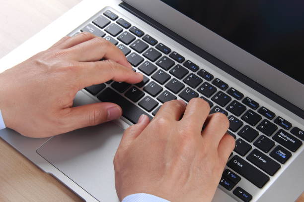istock Male hand typing with laptop 837909942