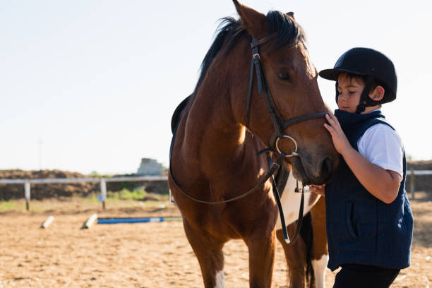 istock Boy sitting on the horse back 837939102