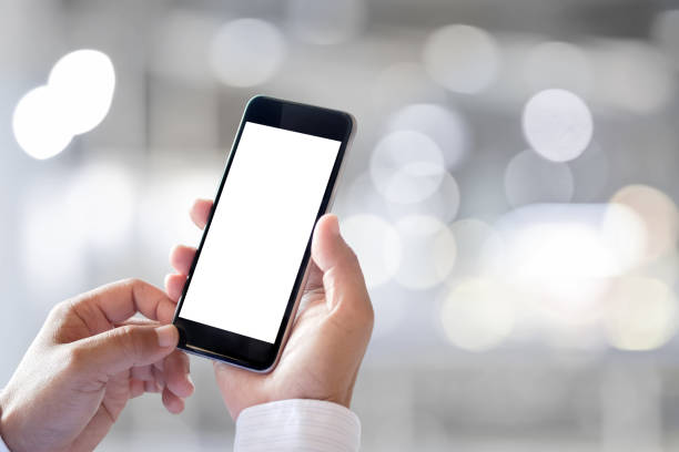 istock Man holding and typing text message on smart phone, Blurred background 837939540
