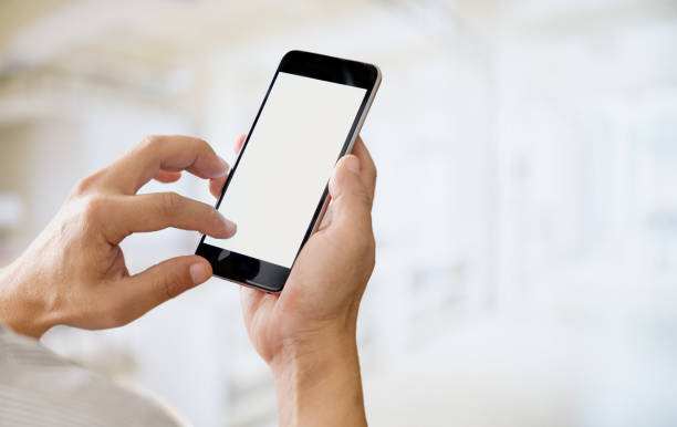 istock Man holding smart phone with blurred background. For Graphic display montage. 837945158