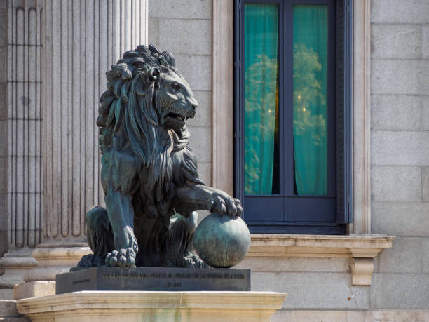 Lion statue in front of Congress of Deputies, Madrid, Spain stock photo