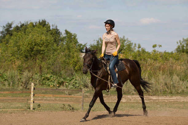 istock Women is horse riding, vertical 837957114