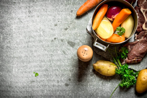 istock Cooking soup with vegetables and meat. 837982262