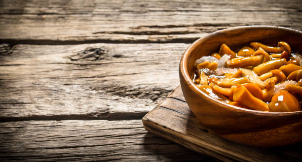 istock Marinated mushrooms in a bowl on the Board. 837998554