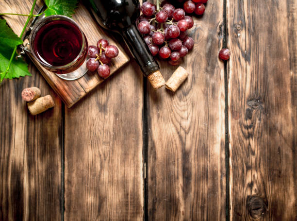 istock Red wine with a vine branch. 838008386