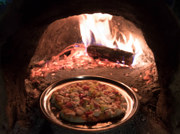 istock Homemade pizza with charcoal stove 838017286