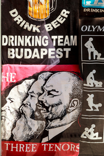 BUDAPEST HUNGARY APRIL 29 2014: Street art advertisement and T-shirts now making fun out of the once hard line communist system. Budapest is the perfect place to walk and looking for street art.