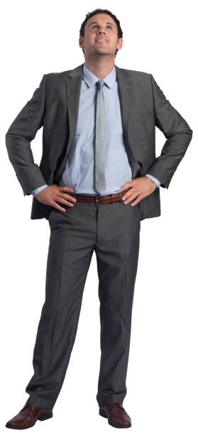istock Smiling businessman with hands on hips 838020214