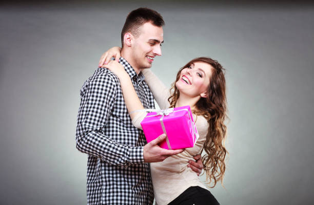 istock happy romantic couple with gift 838020440