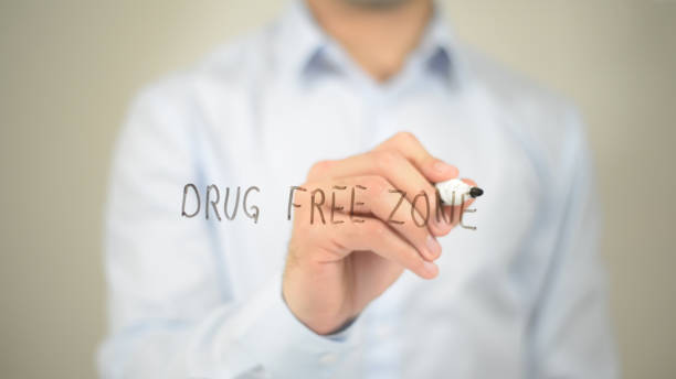 drug free zone, man writing on transparent screen - writing whiteboard men businessman imagens e fotografias de stock