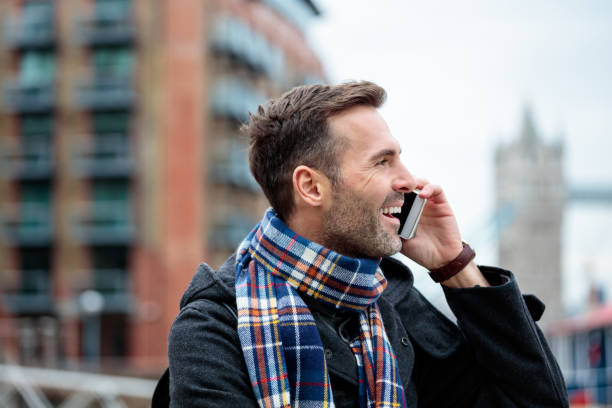 istock Mature man using smart phone outdoors 838029690