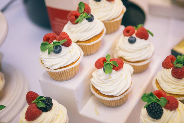istock Easter cupcake with raspberries and blueberries on plate, closeup 838033476