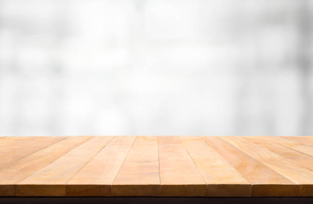 istock Wood table top on glass wall abstract background. 838044018