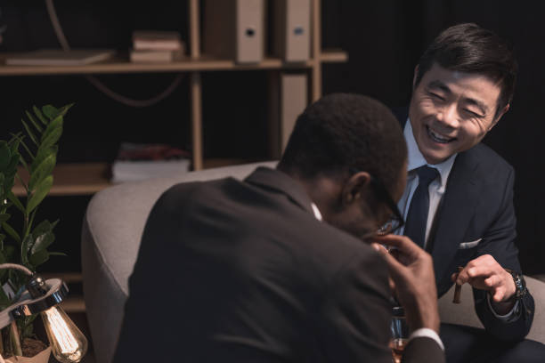 istock successful multiethic businessmen laughing in dark room 838044072