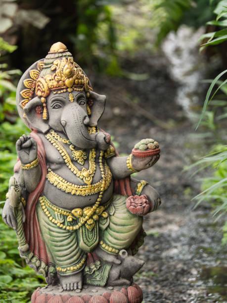 Ganesh Statue God of Artistic Standing Ganesh Statue God of Artistic Standing in The Garden ganesh stock pictures, royalty-free photos & images