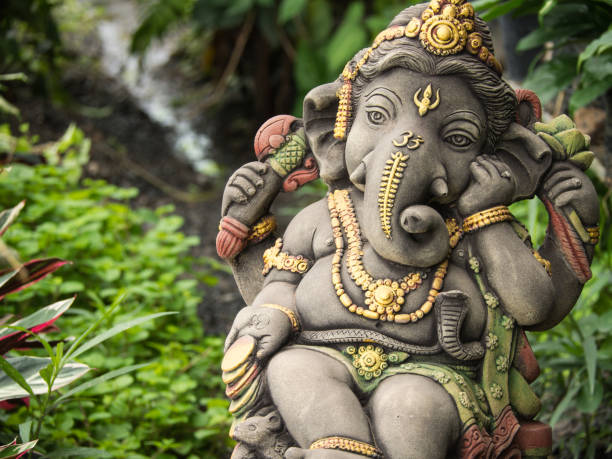 Ganesh Statue God of Immortality Ganesh Statue God of Immortality , Standing in The Garden ganesh stock pictures, royalty-free photos & images