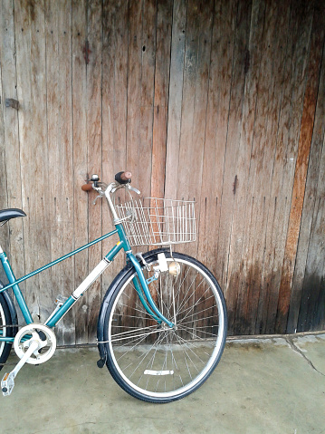 Vintage bicycle parking backdrop is wood
