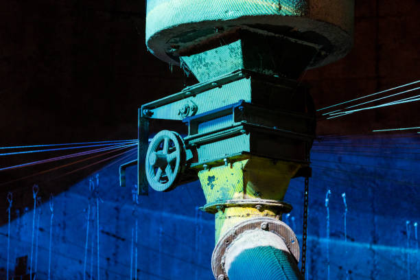 istock Old iron wheel on colored industrial pipe lines 838051660