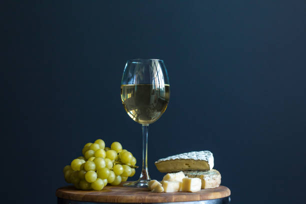 istock Glass with white wine and grapes near cheese composition 838063598