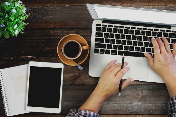 istock Mock up : man working with laptop on Wood modern work space desk table with tablet. 838074326