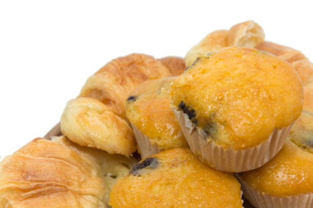 istock Banana Cup Cakes with raisin topping isolated on white background 838076272