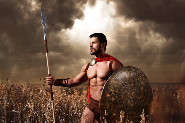 istock Warrior wearing like spartan holding iron weapon 838078334