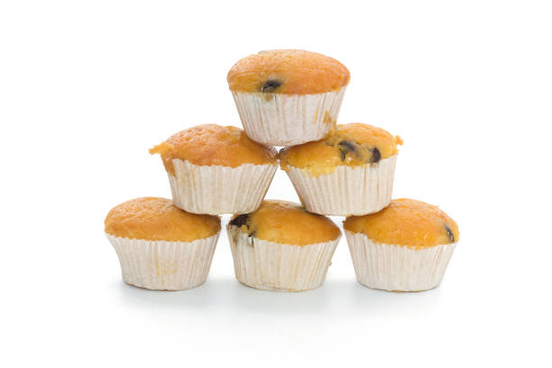 istock Banana Cup Cakes with raisin topping isolated on white background 838078396