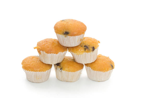 istock Banana Cup Cakes with raisin topping isolated on white background 838078596