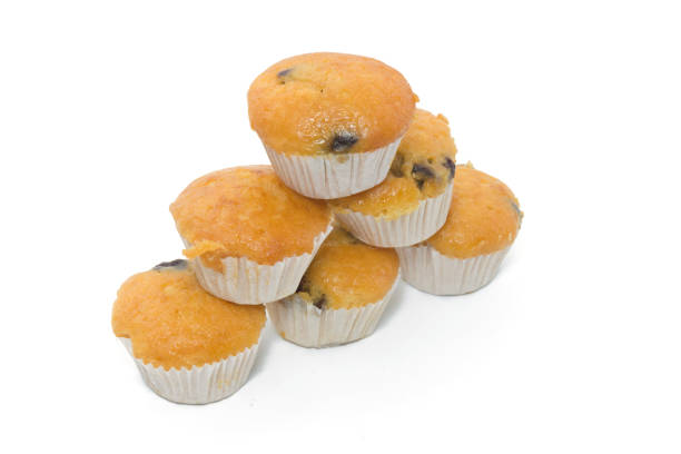 istock Banana Cup Cakes with raisin topping isolated on white background 838078742