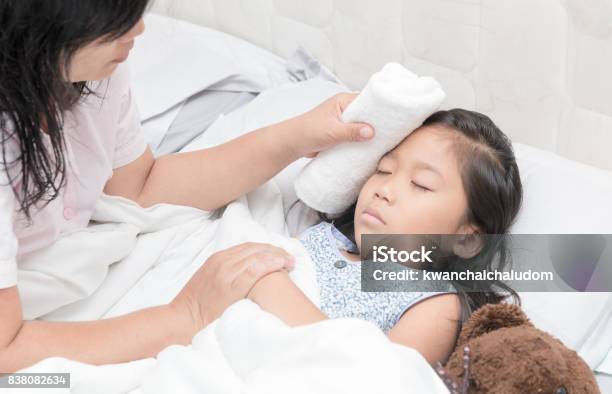 Mother Wiped Daughters Body To Reduce Fever Stock Photo - Download Image Now - Fever, Child, Asia
