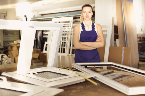 istock Confident girl assembler of plastic windows standing with arms crossed 838083830