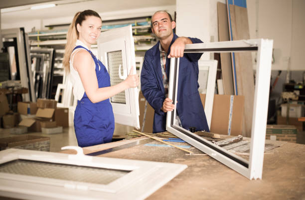 istock Portrait of smiling two workers  assembling pvc windows 838084198