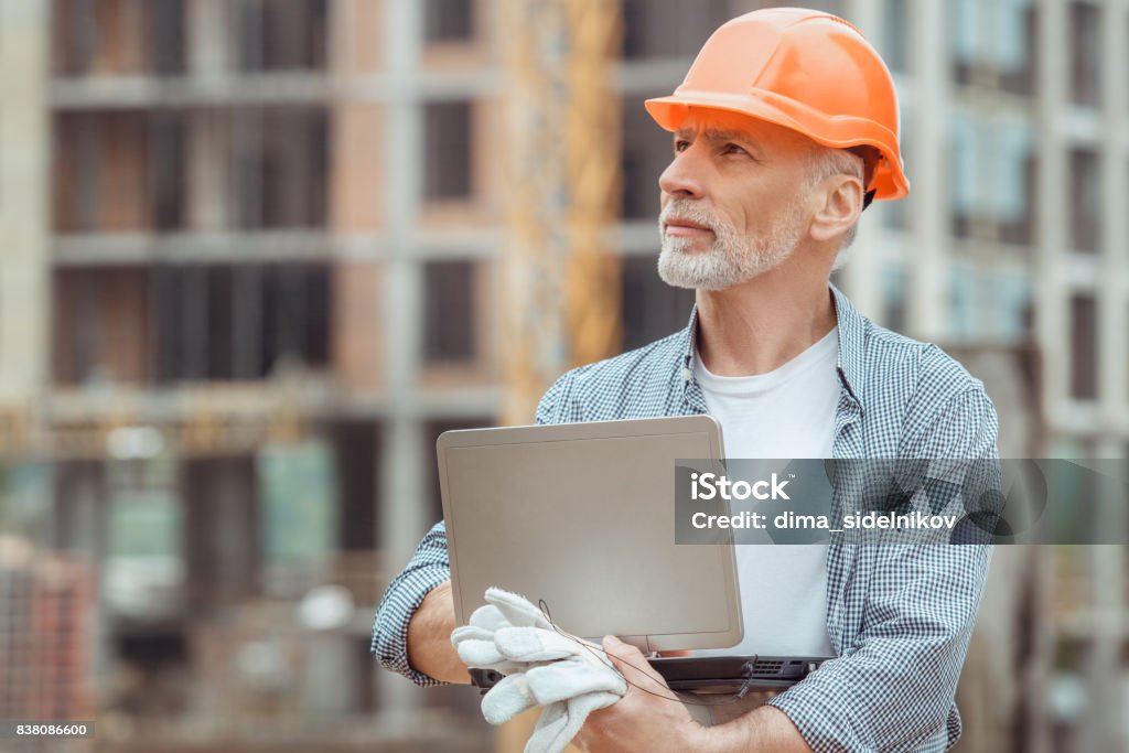 Male work building construction engineering occupation project Male work building construction engineering occupation using digital device Adult Stock Photo