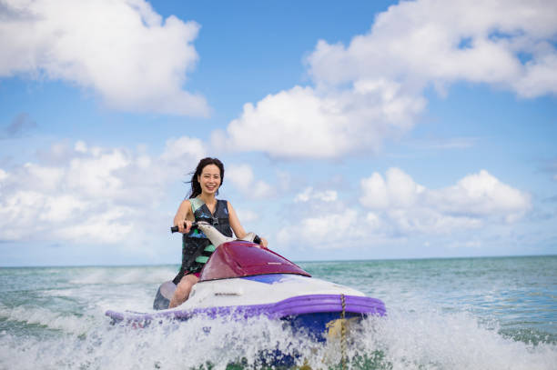 San Juan, Puerto Rico - April 02 2014: Three Jet Ski riders on the ocean off the coast of Old San Juan in Puerto Rico.
