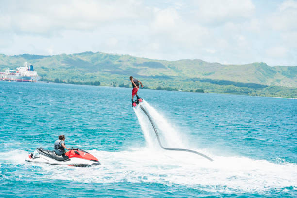istock Man enjoy flyboarding in guam resort 838094210