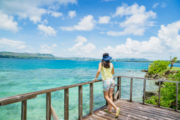 istock Women standing a beach in guam 838094280