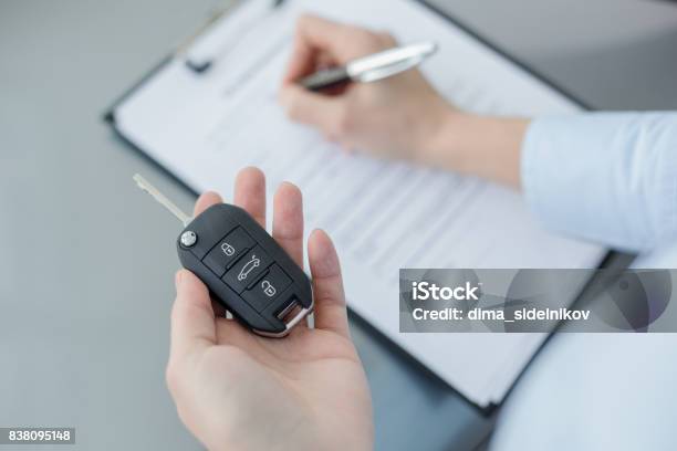 Young Woman In A Car Rental Service Assistant Concept Stock Photo - Download Image Now