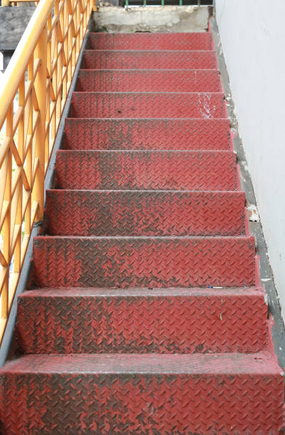 istock Old red diamond metal plate staircase. 838095592