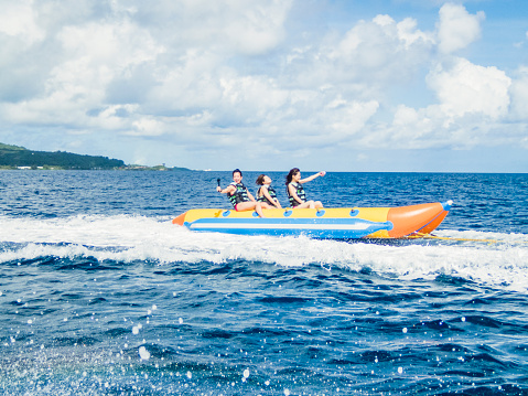 Couple enjoying tubing on sunny day