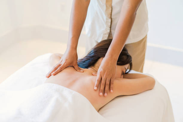 istock Young adult woman relaxing during massage 838100264