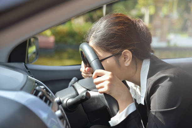 istock Business woman sleeping while driving a car. 838102342