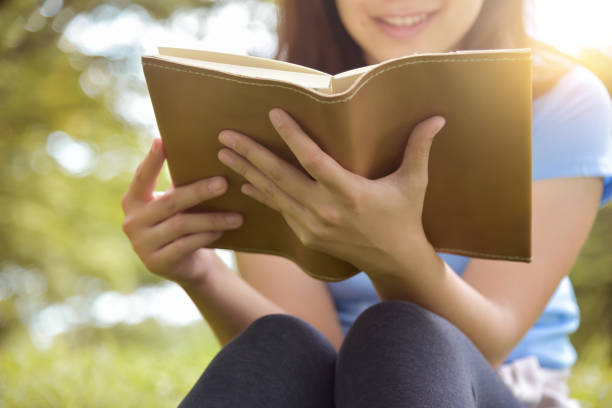 istock Asian woman in Blue shirt reading a book. 838102364