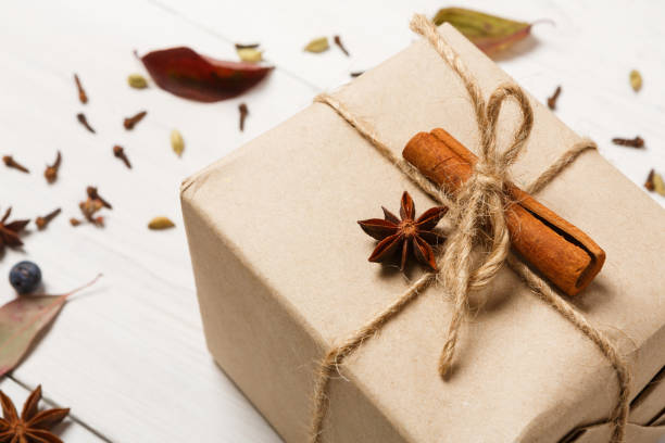 istock Winter background with present box on white wood 838102368