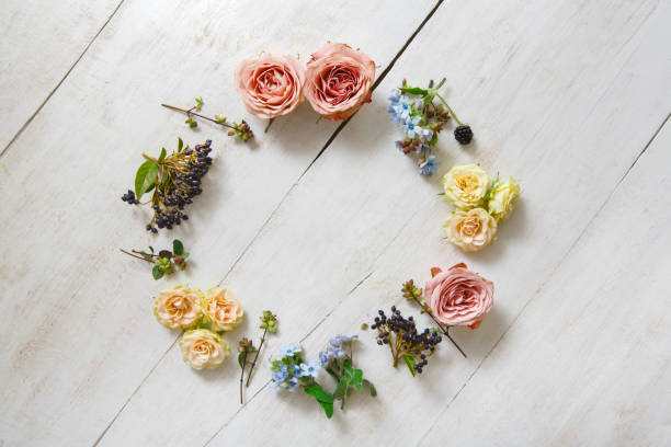 istock Flowers circle on white wood, top view 838103068