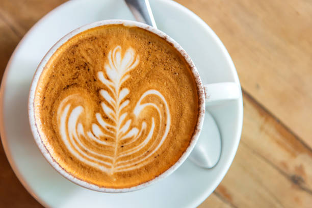 istock latte art coffee or cappuccino on wooden table background 838106990
