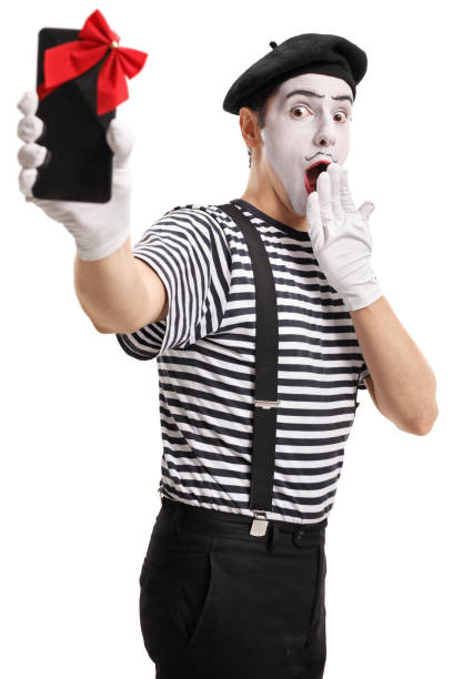istock Surprised mime showing a phone wrapped with red ribbon 838108180