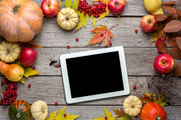 istock Seasonal background with autumn harvest and tablet 838109318