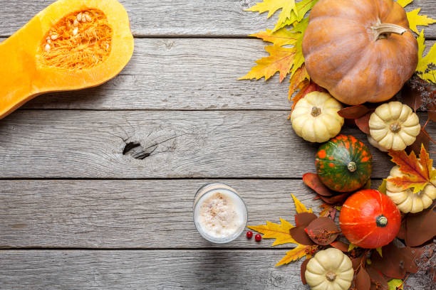 istock Autumn background with yellow leaves and pumpkins 838109560