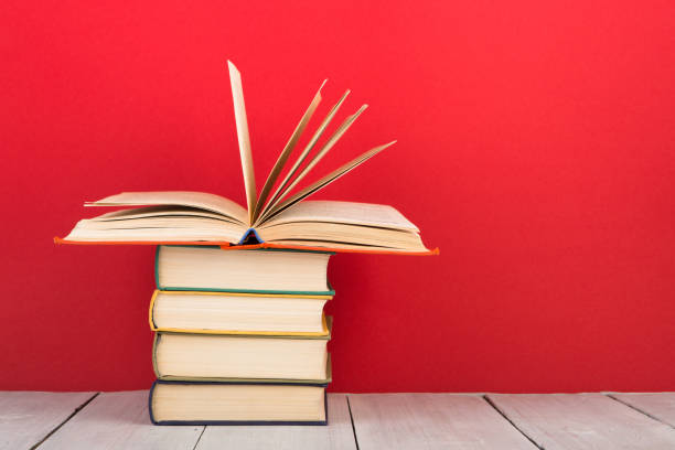 istock education and wisdom concept - open book on wooden table, color background 838112852