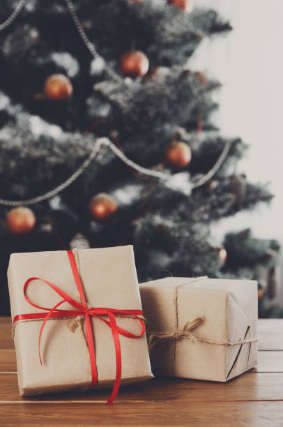 istock Christmas presents on decorated tree background, holiday concept 838117056